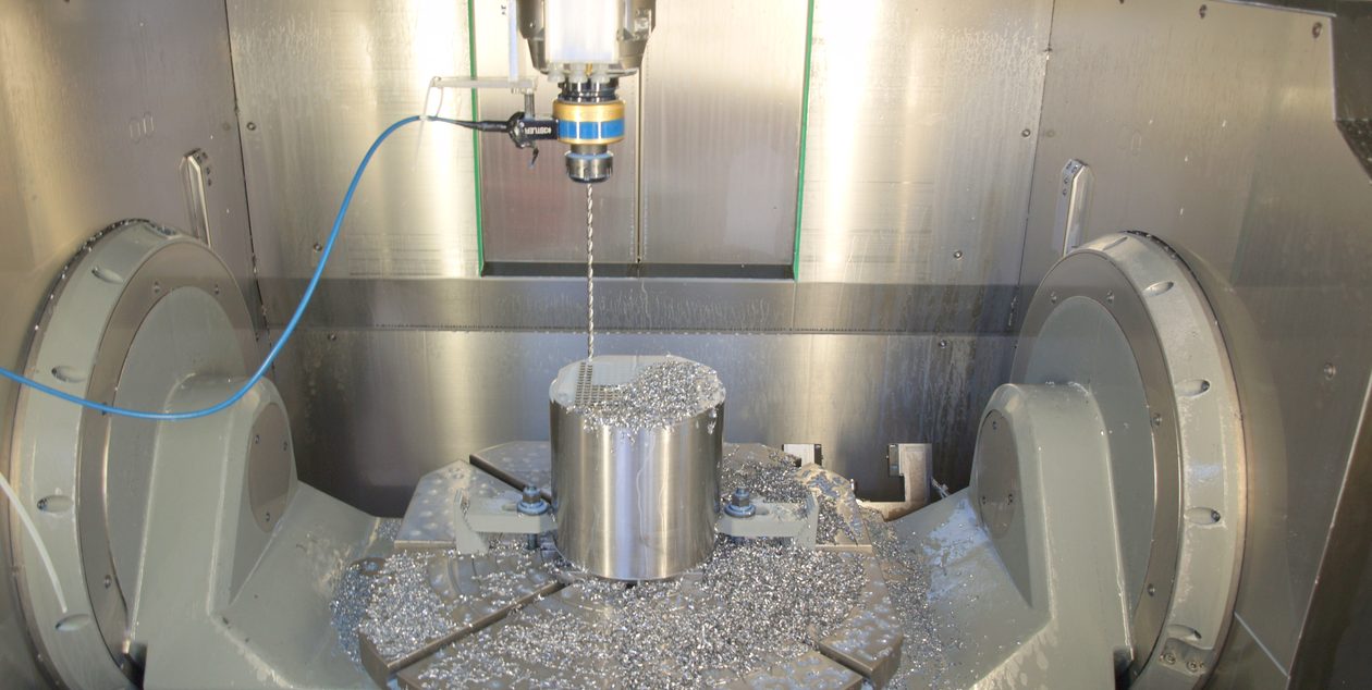 CNC machining centre cutting a metal component